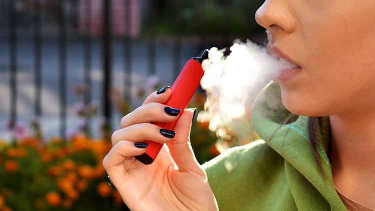 Woman smoking a vape