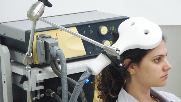 Woman receiving TMS treatment 