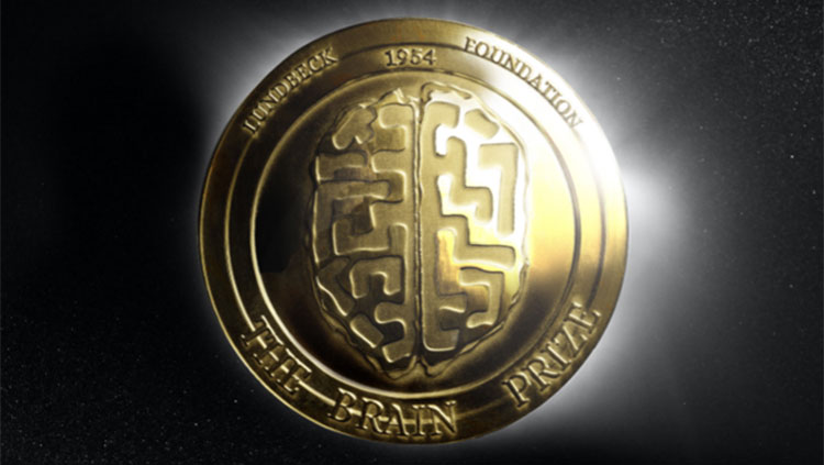 Image of Lundbeck Foundation’s Brain Prize medal by Danish sculptor Margrete Sørensen; circular medal in gold with an etching of the superior view of the human brain reading “Lundbeck Foundation 1954” at the top of the medal and “The Brain Prize” at the bottom