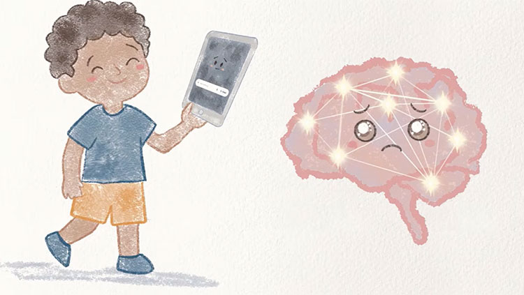 Young boy holding phone next to a brain