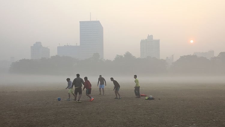 Kids playing with a ball in a hazy environment 