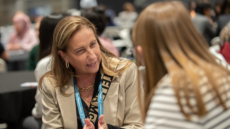 Attendees talking to each other