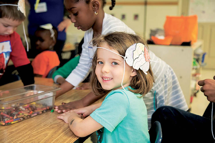children playing with crayons at Brain Awareness Week event