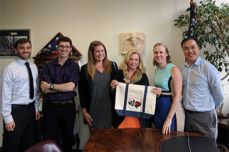 Democratic Rep. Carolyn Maloney (right center) poses for a photo with research advocates (from left to right) Elon Gaffin-Cahn, Avital Percher, Julia Derk, Heather McKellar, and Haung “Ho” Yu.