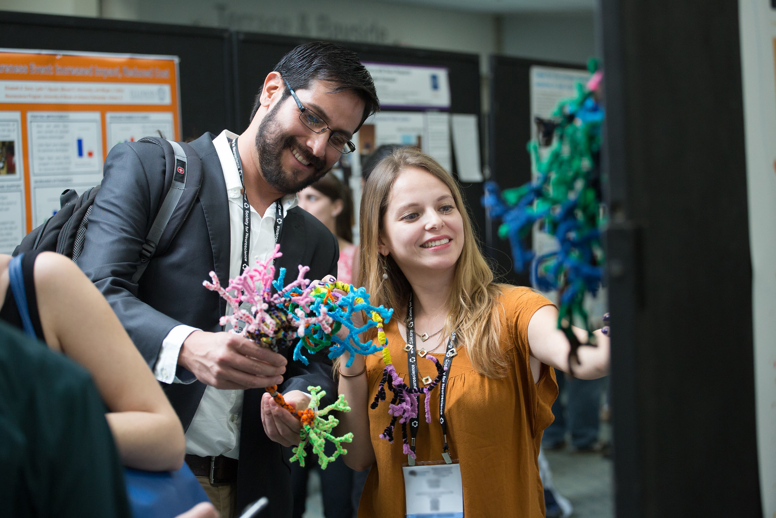 two people looking at scientific models