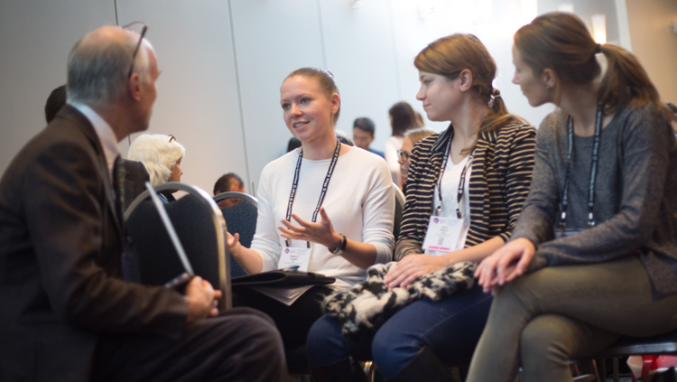 Annual meeting attendees engage in a group discussion