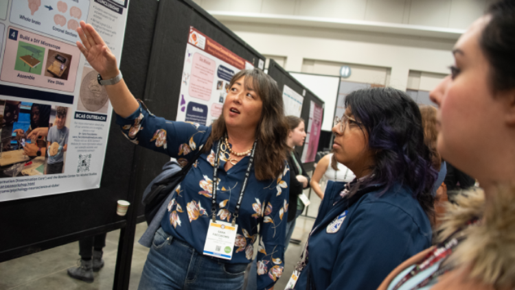 Meeting attendees present and discuss neuroscience research