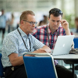 Neuroscience attendees looking at a laptop