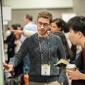 Annual Meeting attendees talking to each other