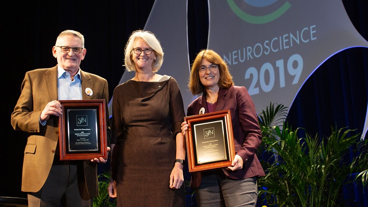Robert T. Knight, MD (right), of the University of California, Berkeley, and Sabine Kastner, MD, PhD (left), of Princeton University, accept the Award for Education in Neuroscience