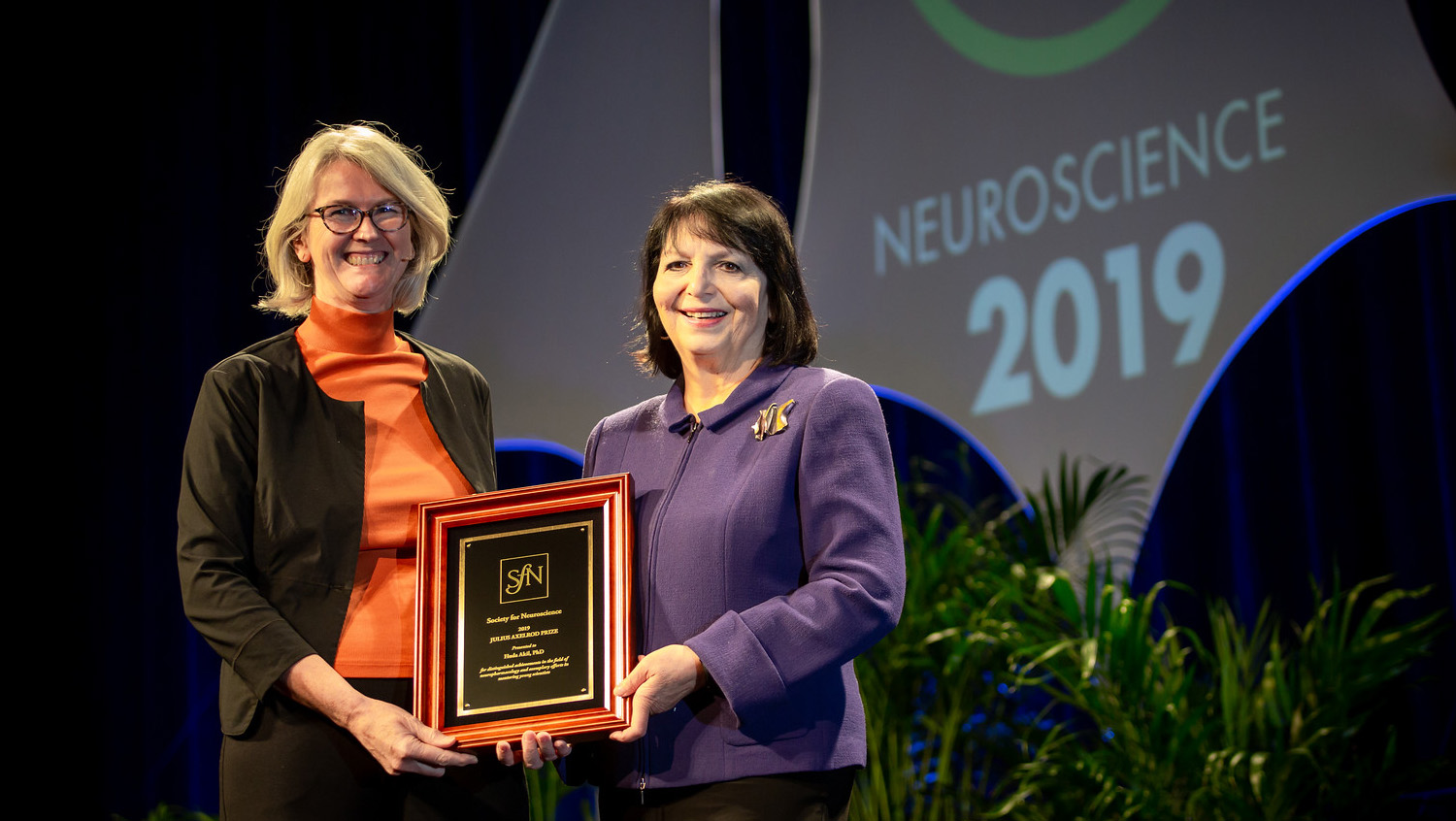 Huda Akil, PhD (right), of the University of Michigan, is honored with the Julius Axelrod Prize