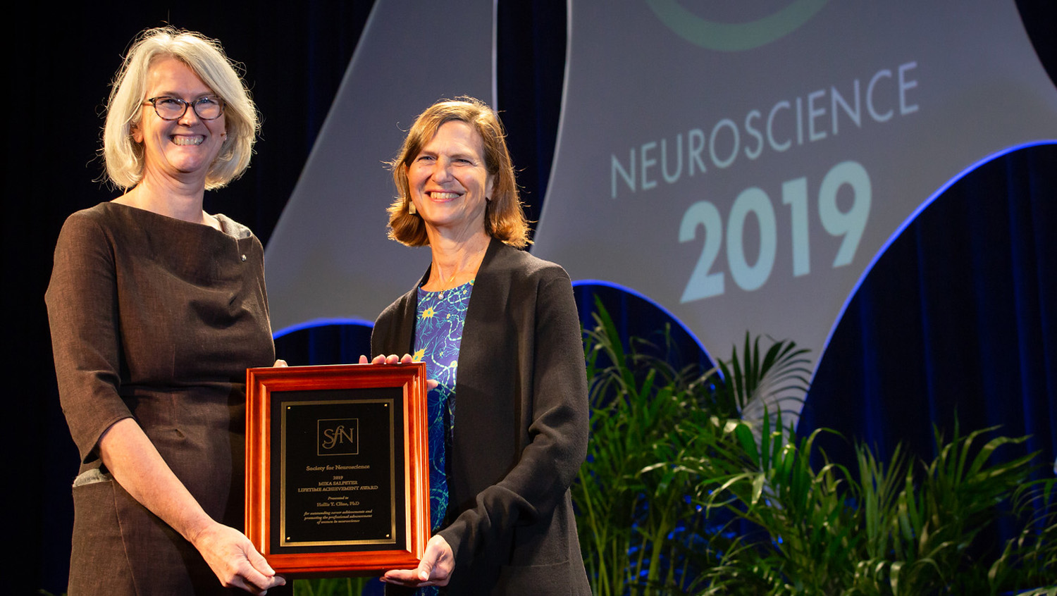 Hollis T. Cline, PhD (right), of the Scripps Research Institute, is honored with the Mika Salpeter Lifetime Achievement Award