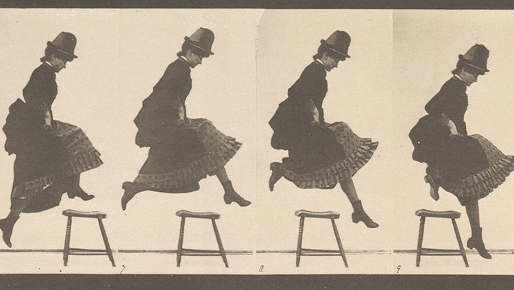 Image of a woman jumping over a stool