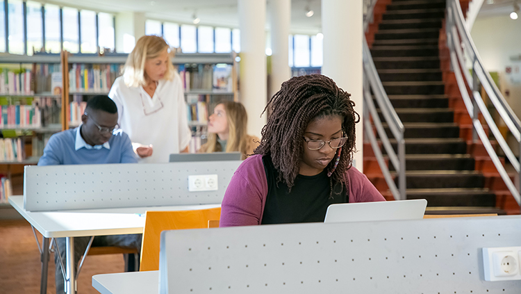 image of student in library